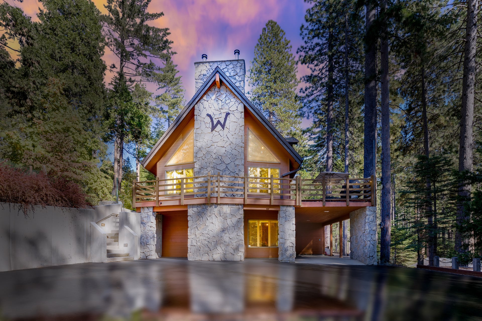 The W House A-frame chalet at dusk in the Sierra forest