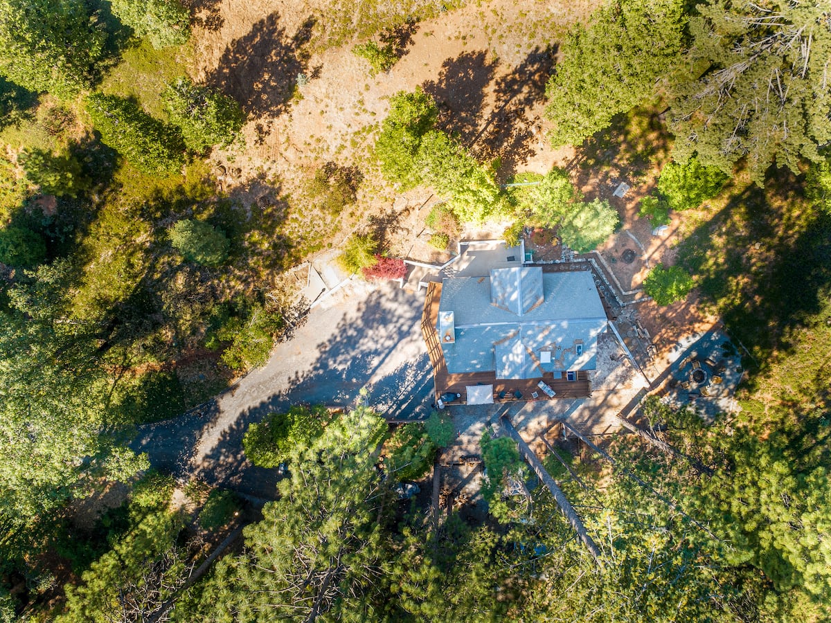 Aerial view of the chalet on over an acre of private forest